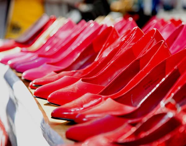Row of brightly coloured high heeled shoes